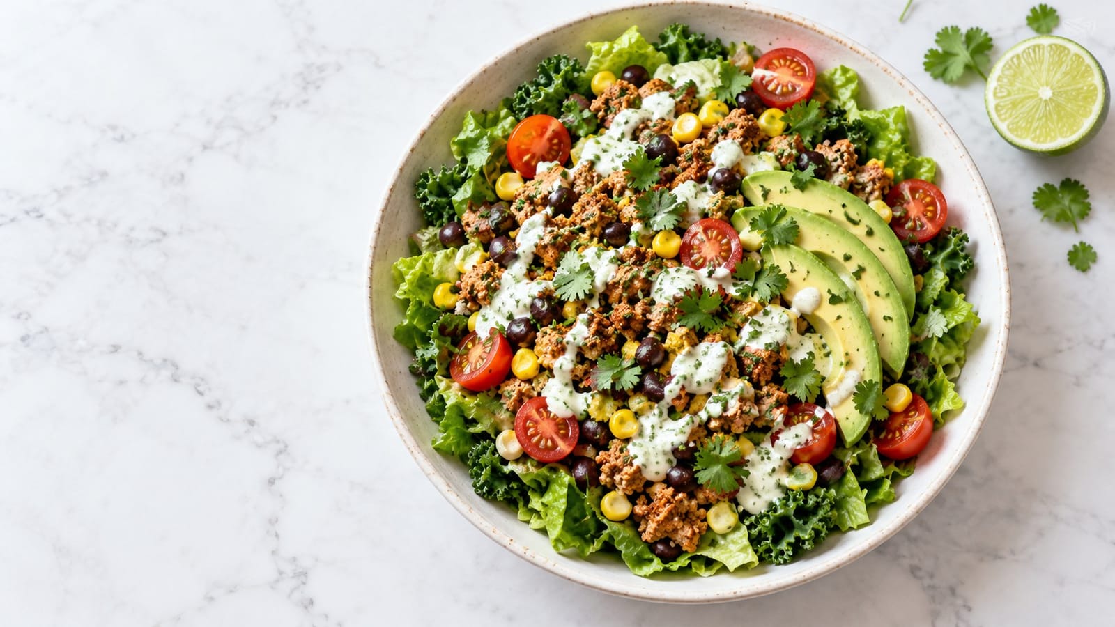 Spiced ground turkey, black beans, corn, tomatoes and avocado on romaine and kale with a lime-yogurt drizzle.